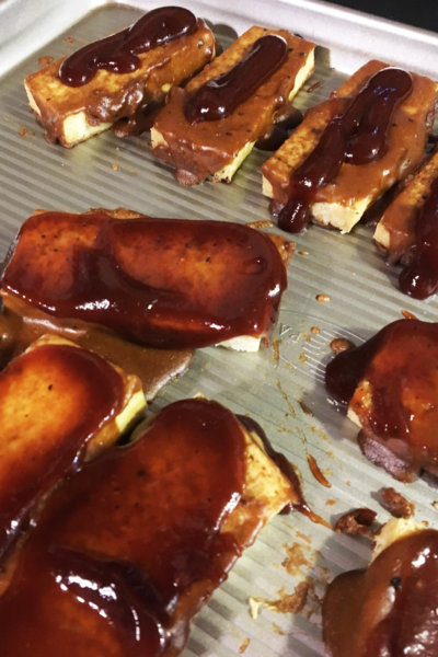 baked bbq tofu on metal baking pan